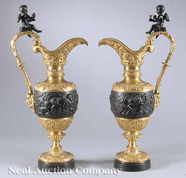 Appraisal: A Pair of French Patinated and Parcel Gilt Bronze Ewers