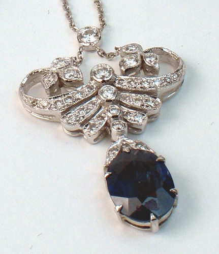 Appraisal: PAIR OF SAPPHIRE DIAMOND AND EIGHTEEN KARAT WHITE GOLD PENDANT