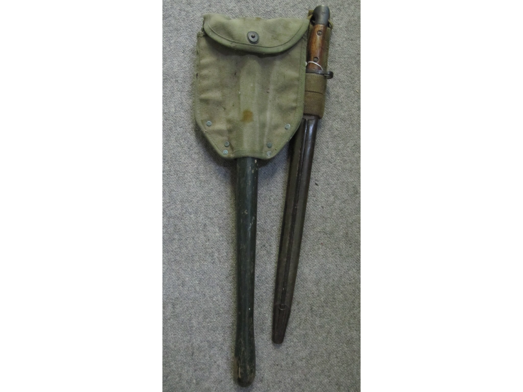 Appraisal: A lot comprising a trenching tool and a bayonet in