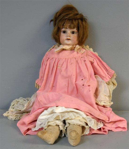 Appraisal: Victorian bisque headed shoulder plate doll with brown glass eyes