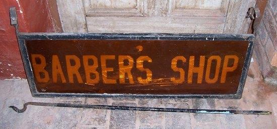 Appraisal: A glass hanging sign for a Barber's Shop cm x