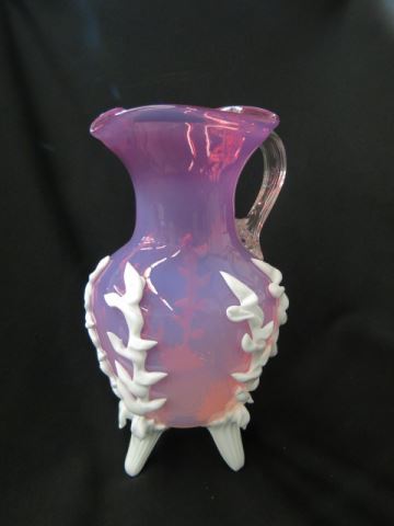 Appraisal: Cranberry Opalescent Art Glass Pitcher applied white trim and feet