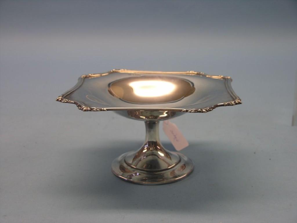 Appraisal: A silver pedestal comport with cast scroll border Sheffield approx