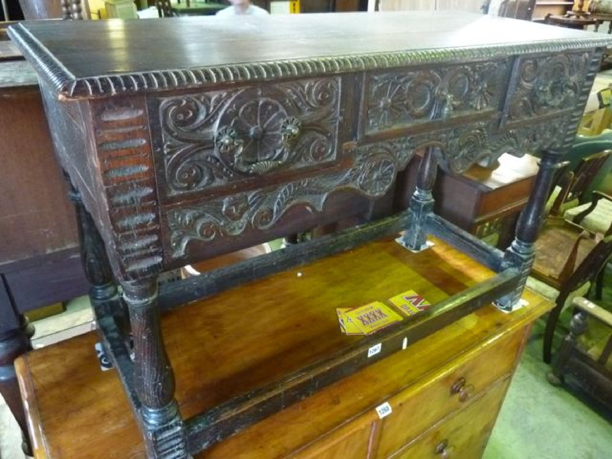 Appraisal: An antique oak side table of rectangular form fitted with