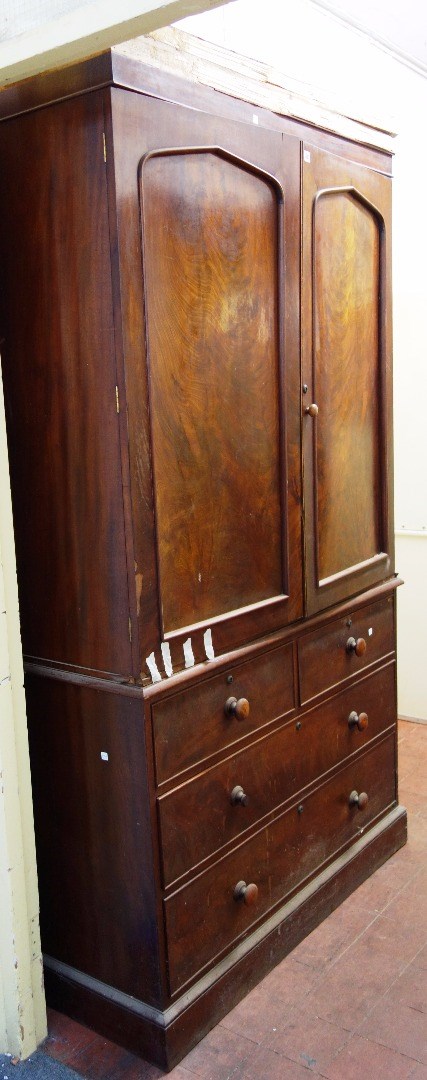 Appraisal: A th century mahogany linen press with pair of arch