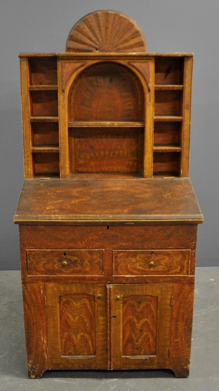 Appraisal: - Grain painted one-piece country desk c with unusual carved