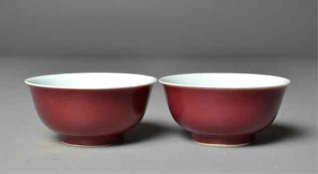 Appraisal: Pair of Chinese Red -Glazed BowlsMatching pair of deep red