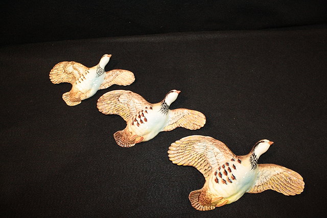 Appraisal: A GRADUATED SET OF THREE BESWICK FLYING PARTRIDGES stamped -