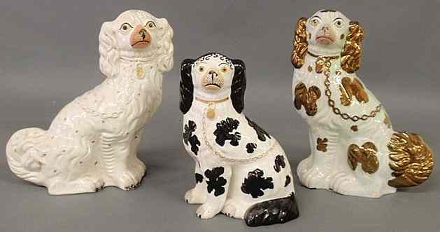 Appraisal: Three th c Staffordshire seated spaniels one h and two