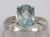 Appraisal: A white metal tests carat gold aquamarine and diamond ring