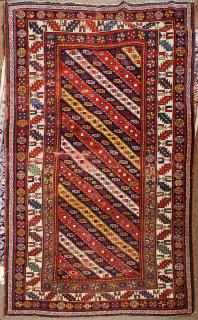 Appraisal: Caucasian carpet Caucasian carpet ' x ' wear