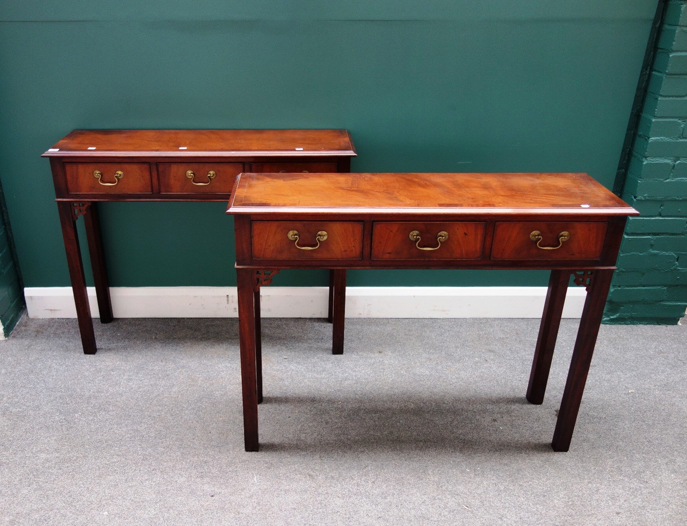 Appraisal: A pair of mid- th century style mahogany three drawer