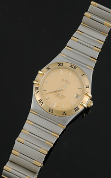 Appraisal: A Gents Omega Constellation wristwatch Automatic circular gold dial with