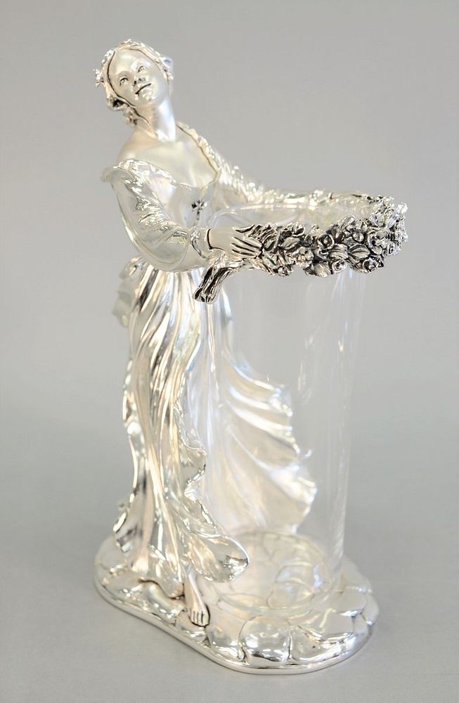 Appraisal: Silvered figured vase woman with garland holding a glass vase