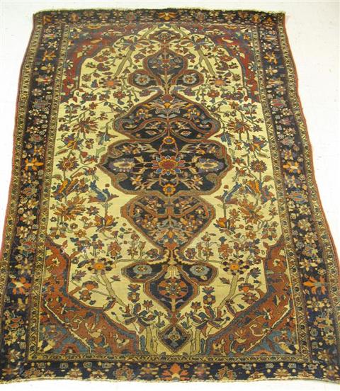 Appraisal: ORIENTAL NAVY AND RED ON CREAM GROUND RUG X in