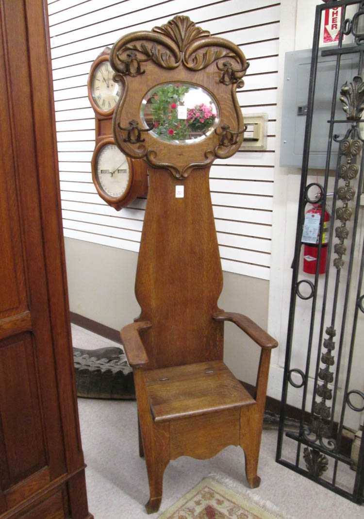 Appraisal: LATE VICTORIAN OAK ARMCHAIR HALLSTAND American c the armchair having