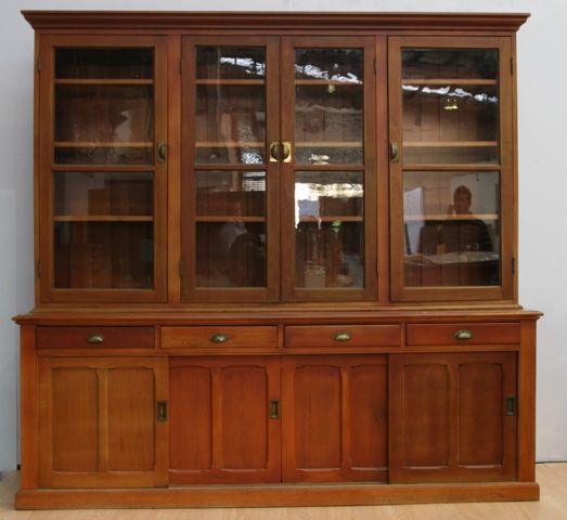 Appraisal: An early th century stained pine four door bookcase cm