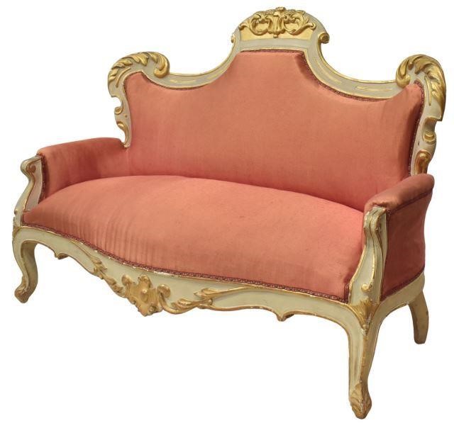 Appraisal: Baroque style upholstered sofa thc having a carved foliate crest