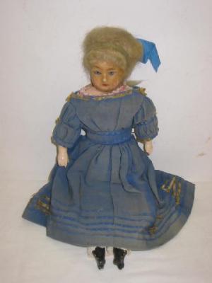 Appraisal: A wax over composition shoulder head doll with blue sleeping