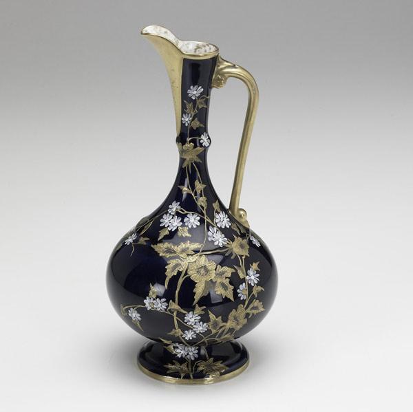 Appraisal: Greenwood ewer with gilded decoration of blossoms on a cobalt