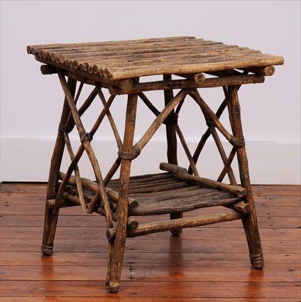 Appraisal: ADIRONDACK TWIG LOW TABLE The rectangular top over trelliswork sides