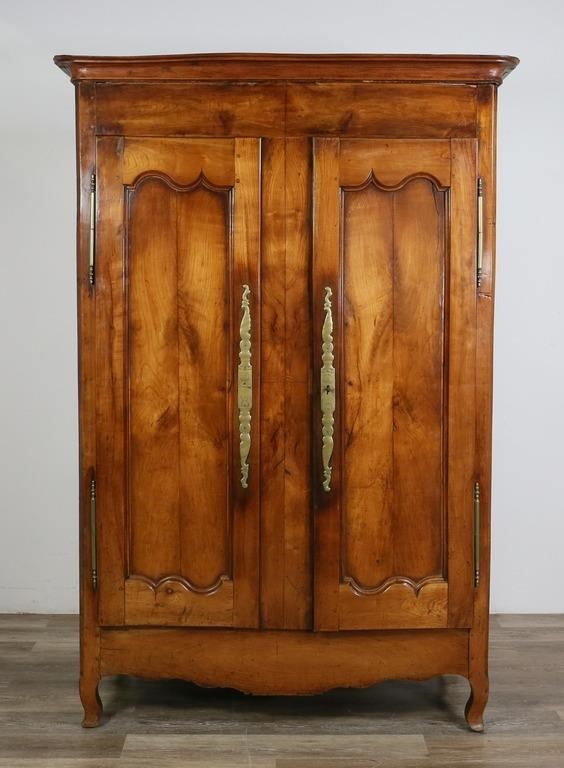 Appraisal: French Provincial armoire Fruitwood and engraved escutcheons Splitting and cracks