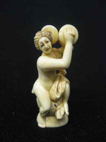 Appraisal: Carved Ivory Netsuke of Seated Nudewith cymbals signed ''