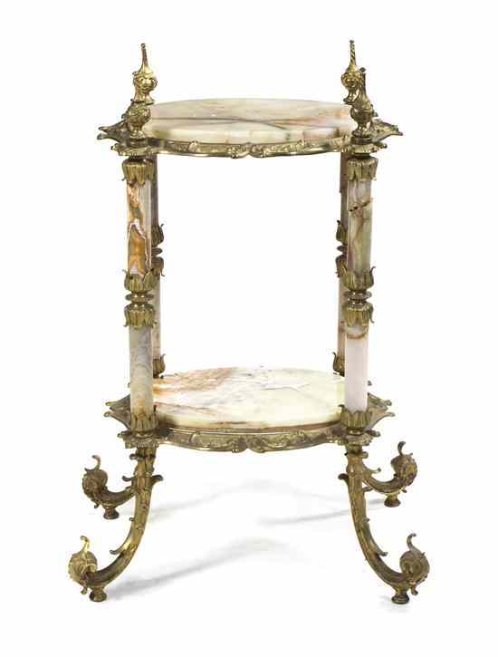 Appraisal: A Neoclassical Gilt Bronze and Onyx Occasional Table having two