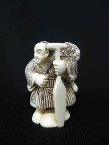 Appraisal: Carved Ivory Netsuke of a Man with an Oar fancy