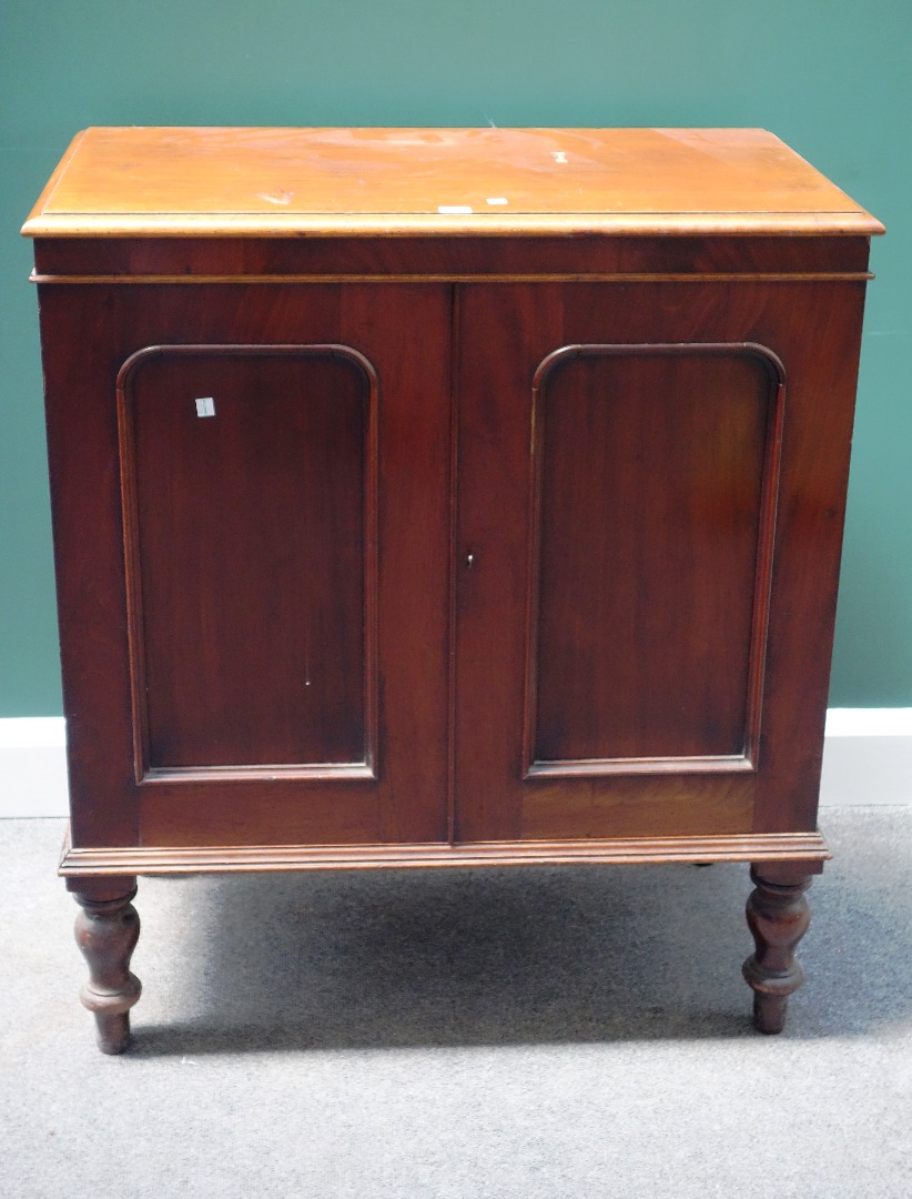 Appraisal: A Victorian mahogany collector's cabinet the pair of arched panel