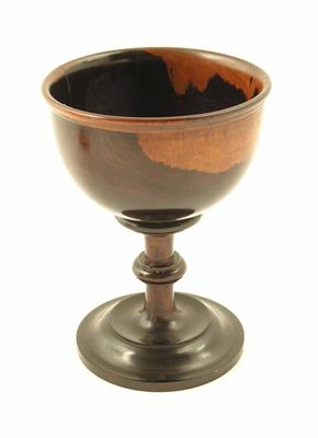 Appraisal: An early th century turned lignum vitae goblet with a