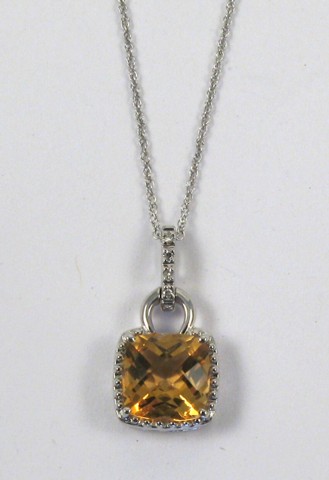 Appraisal: CITRINE AND DIAMOND PENDANT NECKLACE The pendant is set with