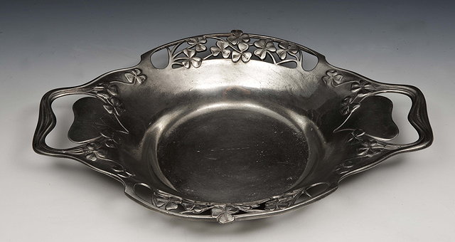 Appraisal: Archibald Knox British - Two handled pewter bowl with pierced