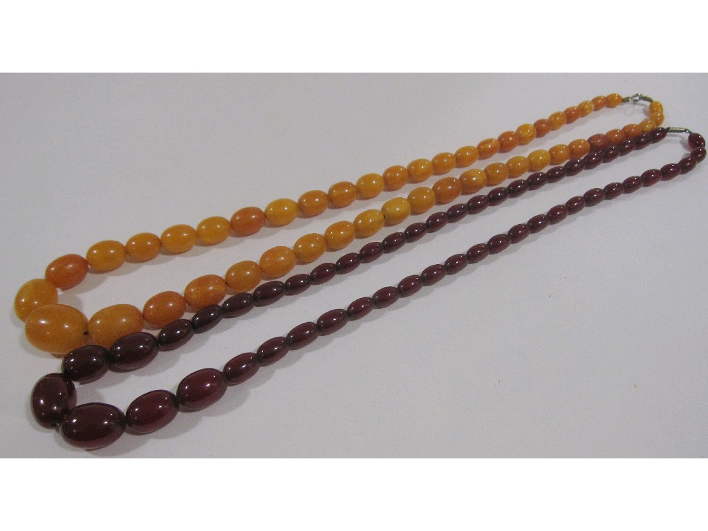 Appraisal: Lot comprising a string of red amber beads and a