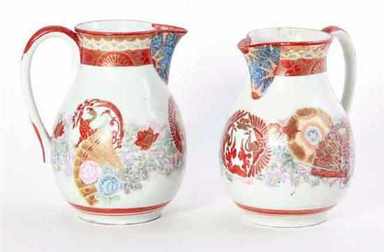 Appraisal: Pair Japanese Kutani porcelain pitchers late th century fan designs