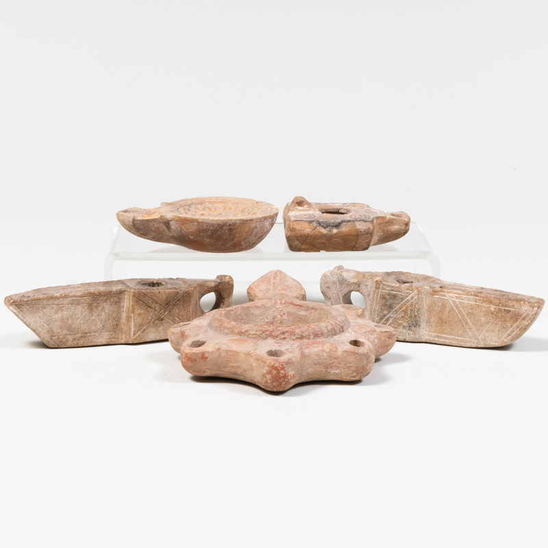 Appraisal: GROUP OF FIVE POTTERY OIL LAMPS The largest in long