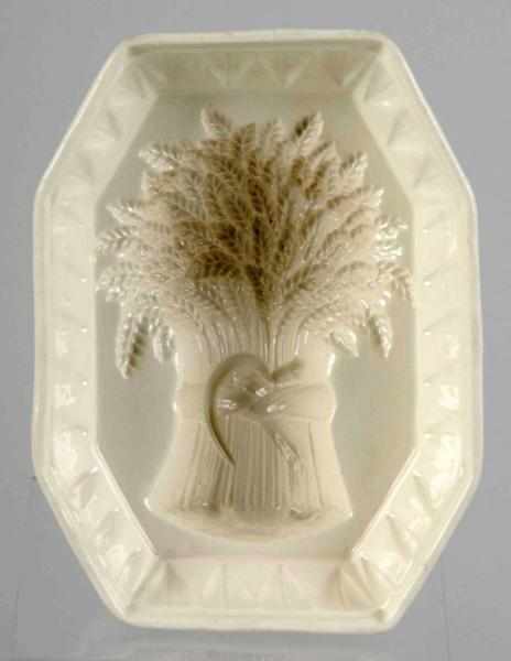 Appraisal: White Pottery Wheat Bundle Butter Mold Description Marked Ridgewood Condition