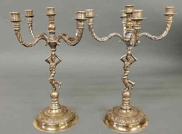 Appraisal: Pair of Continental silver candelabra each with a robed figure