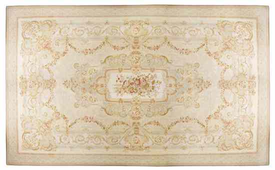 Appraisal: An Aubusson Style Wool Rug centered with a spray of