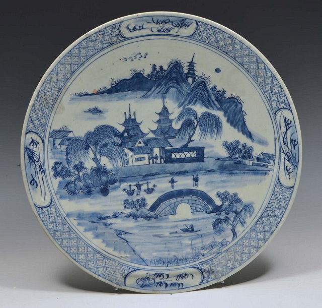 Appraisal: A CHINESE BLUE AND WHITE CHARGER with temples bridge and