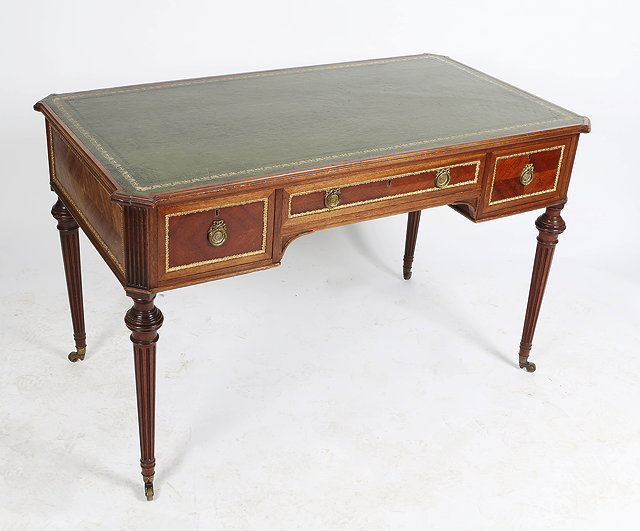 Appraisal: A LOUIS XVI STYLE MAHOGANY KNEEHOLE WRITING DESK fitted one