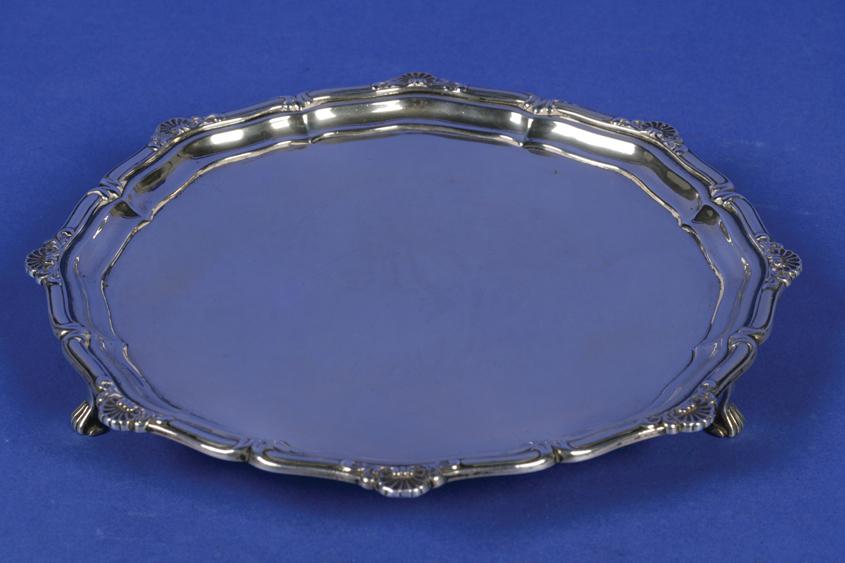 Appraisal: A GEORGE V WAITER of shaped circular form with a