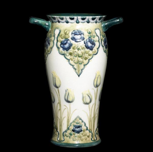 Appraisal: MacINTYRE Tall two-handle vase with tulips and poppies on white