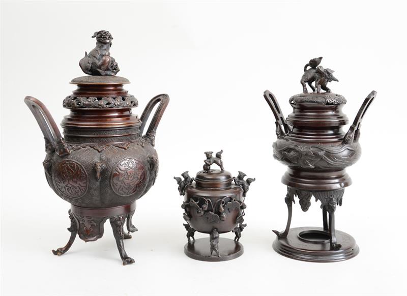 Appraisal: THREE CHINESE ARCHAIC STYLE BRONZE TRIPOD CENSERS AND COVERS WITH