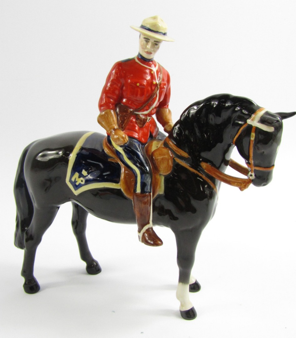 Appraisal: A Beswick pottery figure of a Canadian Mounted Policeman on