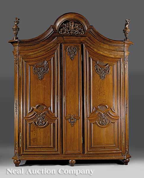 Appraisal: A Monumental Louis XVI-Style Carved Oak Armoire th c the