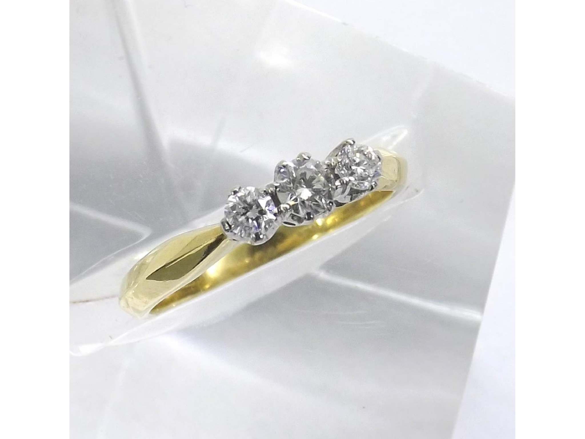 Appraisal: - -a ct yellow gold three stone brilliant-cut diamond ring