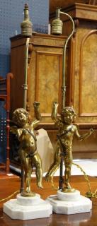 Appraisal: Continental gilt figural lamps Continental gilt figural lamps each standard