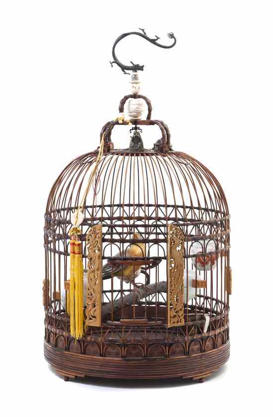 Appraisal: A Chinese Bamboo Birdcage of dome form suspended from a