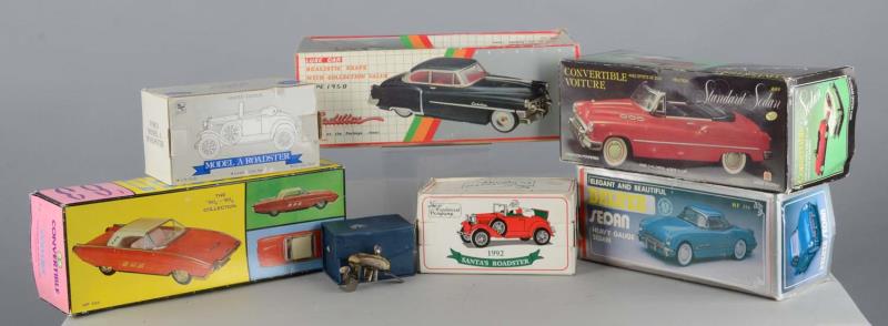 Appraisal: Lot of Diecast Cars and Boat Motor - Miniature wind-up